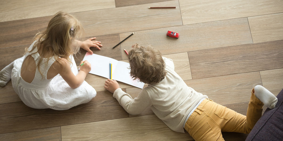 Kids color on a beautiful floor.